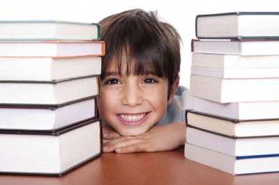 Boy with pile of books